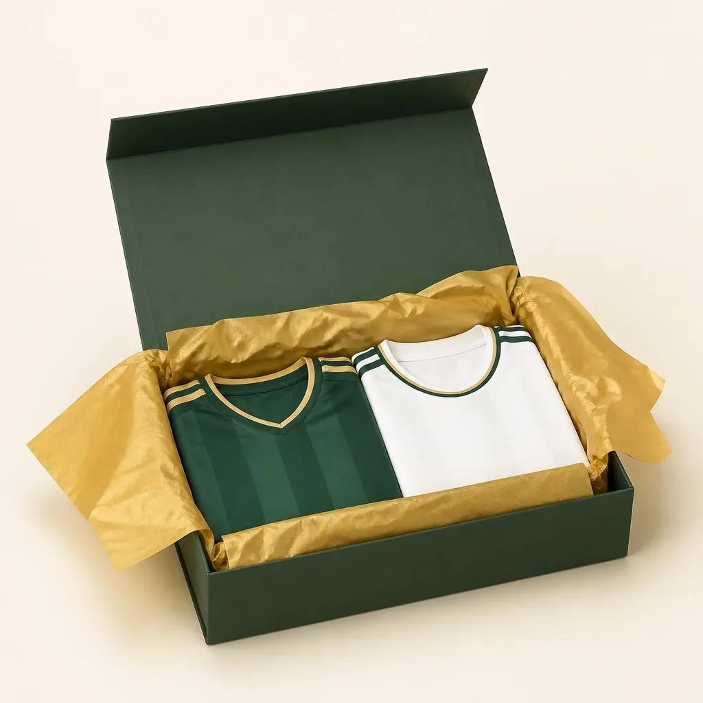 Kick Off Closet mystery box with two folded jerseys in gold tissue